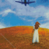 Woman in Field Looking Up at an Airplane Diamond Painting